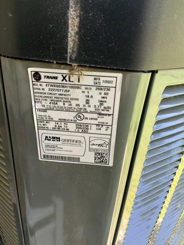 Responded to service call for Trane XLi air conditioning unit experiencing coil freezing and inadequate cooling. Upon arrival, connected digital manifold gauges to assess system pressures and temperatures. Customer reported previous low refrigerant condition identified by another technician, with dye test performed and system recharged last year. Evaluated current refrigerant levels and system performance on the 2022 model unit. Documentation indicates ongoing refrigerant loss requiring comprehensive leak detection to identify source of leak that was not located during previous service visit.
