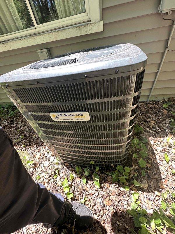 Completed routine cooling maintenance on residential cylindrical air conditioning condenser unit. Performed standard inspection of outdoor unit including condenser coils, fan operation, and electrical connections at exterior disconnect box. Unit operational and ready for continued service through the cooling season.
