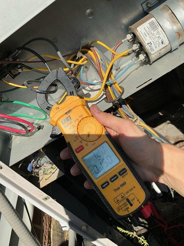 Completed routine cooling system maintenance visit on residential air conditioning unit. Performed electrical diagnostics using clamp meter to verify proper amperage draw on compressor and fan circuits, measured system operating temperatures at ductwork registering 48.5°F supply air temperature, and inspected capacitor and all electrical connections for proper operation. All components found operating within manufacturer specifications with no deficiencies noted.