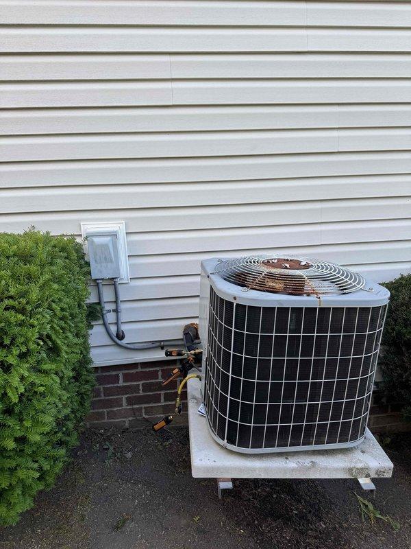 Responded to no-cooling complaint with condenser fan cycling off and water discharge from basement area. Upon arrival, inspected outdoor condensing unit and found system had been shut down by customer. Examined control board showing signs of age and potential relay failure affecting condenser fan operation. Water leakage indicated condensate drain issue or secondary drain pan overflow from system shutdown. Inspected PCB components including relays, resistors, and wiring connections for signs of failure or deterioration. Evaluated outdoor unit installation on concrete pad with proper clearances maintained. Addressed electrical control malfunction preventing proper condenser fan operation, which was causing inadequate heat rejection and loss of cooling capacity.