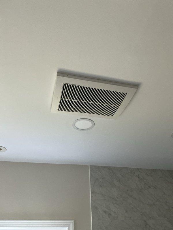 Responded to water leak complaint following recent air handler installation. Upon arrival, retrieved wet switch from shop as needed for repair. Customer reported water intrusion into bathroom from newly installed air handler unit. Inspected ceiling-mounted bathroom ventilation assembly and accessed attic space above affected area. Found evidence of moisture damage on attic flooring near air handler location, with visible water staining and wet spots present. Observed condensate drain line routing and identified improper drainage as likely cause of leak. Addressed drainage issue and installed wet switch to prevent future overflow conditions. Verified proper condensate removal and confirmed no active leaking upon completion of repairs.