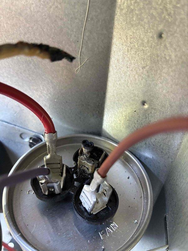 Responded to complaint of inadequate cooling and weak airflow to first and second floors following recent AC installation two months prior. Performed diagnostic testing and temperature measurements on newly installed system. Upon inspection, identified potential refrigerant line connection issues at outdoor unit, evidenced by discoloration and wear on line set fittings. Measured supply air temperature at 77.3°F, confirming insufficient cooling performance. Documented equipment condition with photos showing compromised connections and possible refrigerant leak at service ports. Recommended follow-up service to pressure test system, verify refrigerant charge levels, and inspect installation quality of line sets and electrical connections to restore proper cooling capacity to affected zones.