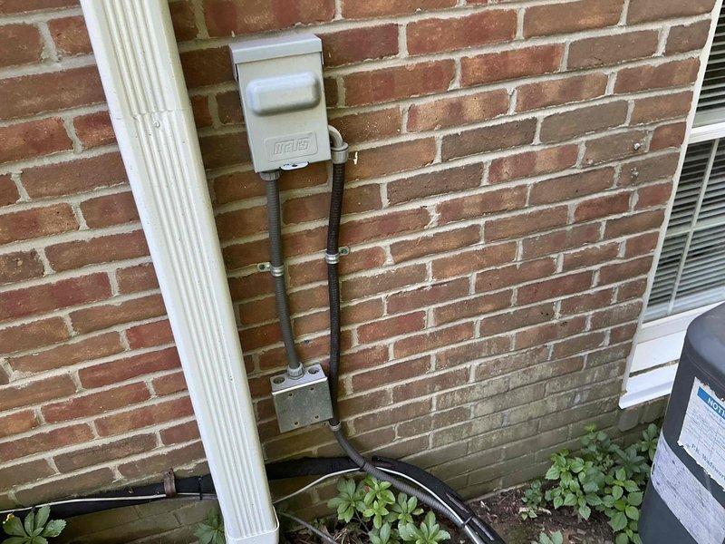 Arrived on-site during scheduled morning window to evaluate existing air conditioning system and present replacement options to homeowner. Assessed exterior condensing unit located on side of residence with accessible service disconnect and reviewed indoor air handler equipment in basement utility area, discussed available upgrade packages including equipment buyback program, and documented current installation configuration with photographs for proposal preparation.