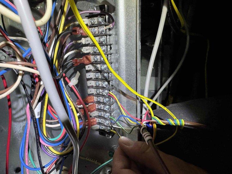 Responded to no cooling call with thermostat displaying blank screen following previous service visit. Upon arrival, discovered complete loss of power to air handler and thermostat. Inspected electrical panel and terminal strip connections, identifying loose or failed low voltage wiring causing system shutdown. Secured all terminal connections, tested control circuit continuity, and verified proper voltage supply to thermostat and air handler. Restored power to system and confirmed unit operation with normal cooling cycle established.