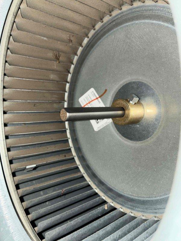 Completed cooling season tune-up on HVAC system. Inspected blower assembly and found moderate dust accumulation on squirrel cage fan blades; cleaned and verified proper rotation. Examined electrical connections in junction box, noting all wire terminations secure at terminal blocks. Observed rust staining on mounting surface near condensate area, indicating previous moisture exposure though currently dry. System tested and operating within normal parameters.