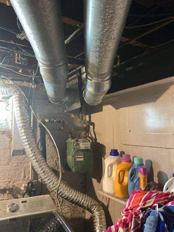 # HVAC Cooling Maintenance Summary

Completed scheduled preventive maintenance service on residential cooling system. Inspected ductwork in basement mechanical area, noting proper condensation formation on supply ducts indicating adequate system operation and airflow. Verified thermostat operation and temperature settings, currently displaying 69°F with proper digital display function. All visible HVAC components including ductwork connections, flexible ducts, and control systems inspected and found operating within normal parameters for continued seasonal cooling performance.