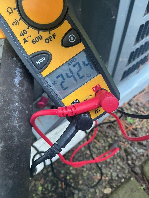 Completed scheduled cooling system maintenance visit. Verified system electrical operation with multimeter reading 24.2V at control circuit, confirming proper low-voltage power supply to thermostat and control board. Inspected and documented air filter condition, noting 16x25x1 pleated filter in place within return air housing.