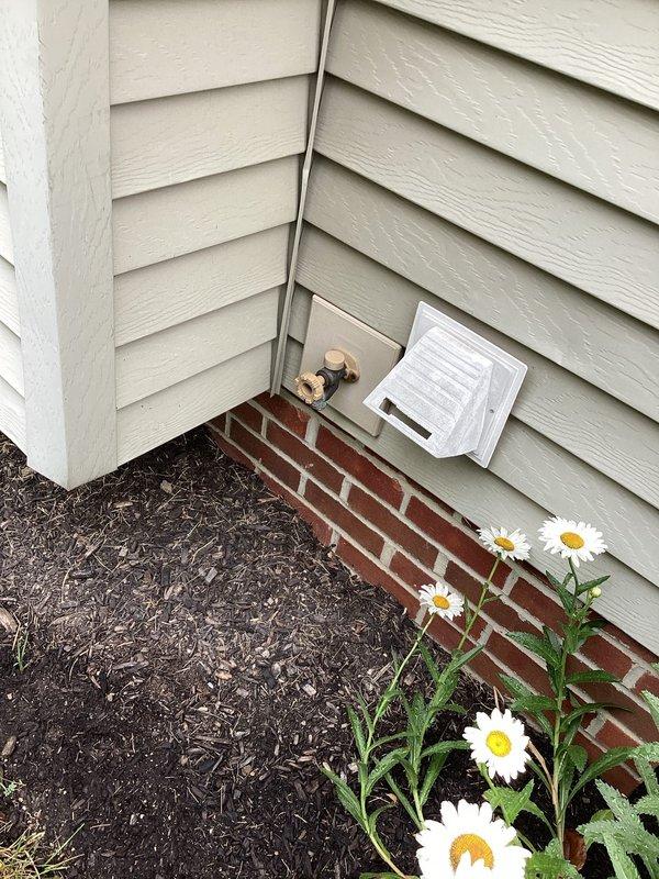 Conducted on-site assessment of exterior hose bib requiring replacement. Inspected outdoor faucet mounted on exterior wall near brick foundation and traced supply line to crawl space shut-off valve. Documented existing copper pipe configuration and valve location for quote preparation. Customer requested estimate for complete outdoor faucet replacement.