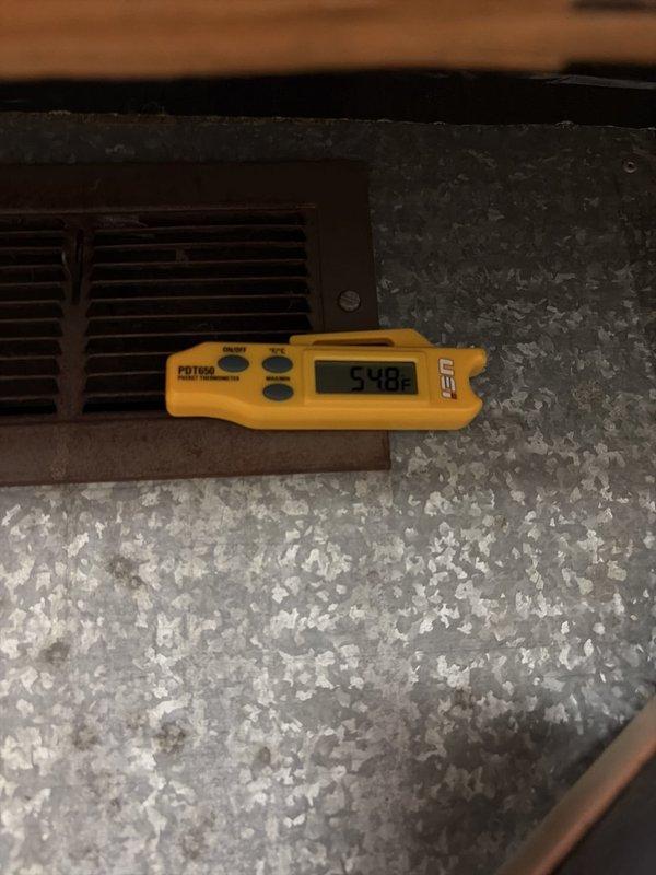 Completed scheduled cooling system maintenance on residential air conditioning unit. Measured supply air temperature at 54.8°F confirming proper cooling output. Observed heavy debris accumulation and dirt buildup on outdoor condenser coils restricting airflow, which was documented for recommended cleaning to restore optimal heat transfer efficiency and system performance.