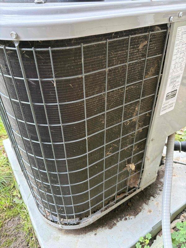 Completed scheduled cooling system maintenance on residential air conditioning unit. Measured supply air temperature at 54.8°F confirming proper cooling output. Observed heavy debris accumulation and dirt buildup on outdoor condenser coils restricting airflow, which was documented for recommended cleaning to restore optimal heat transfer efficiency and system performance.