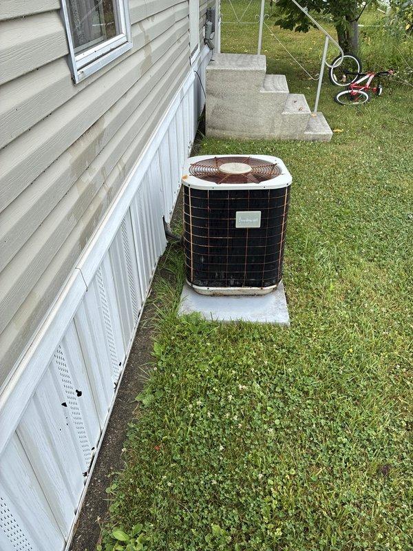 Performed site evaluation of non-functional air conditioning system at mobile home property in preparation for upcoming sale. Assessed existing outdoor condensing unit and documented current equipment condition. Provided replacement options and estimates for new HVAC system to restore cooling capability to the residence.