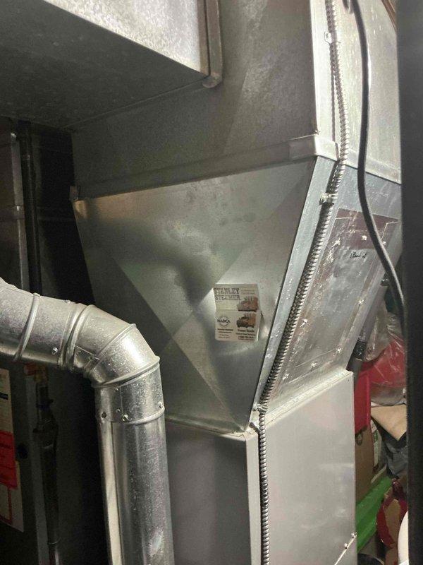 Conducted comprehensive evaluation of existing HVAC system for full replacement estimate. Home warranty company identified current furnace and air conditioning unit as potentially undersized for the residence. Performed detailed assessment of existing equipment installation in basement mechanical room, including furnace, air handler, plenum assembly, and associated ductwork configuration. Documented current system components including metallic supply plenum, galvanized metal ductwork with elbow transitions, and flexible insulated duct runs. Evaluated equipment capacity requirements and existing distribution system to determine appropriate replacement sizing options. Provided multiple replacement system options to address undersizing concerns and ensure adequate heating and cooling capacity for the home.