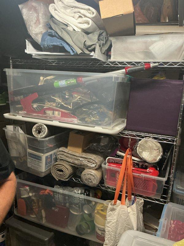 Conducted comprehensive electrical inspection of basement utility area and storage space. Documented existing electrical infrastructure, including exposed conduit runs, wire routing through storage areas, and overhead electrical systems integrated with mechanical ductwork and plumbing installations for compliance verification and safety assessment.