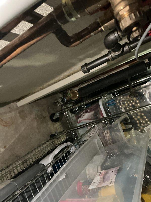 Conducted comprehensive electrical inspection of basement utility area and storage space. Documented existing electrical infrastructure, including exposed conduit runs, wire routing through storage areas, and overhead electrical systems integrated with mechanical ductwork and plumbing installations for compliance verification and safety assessment.