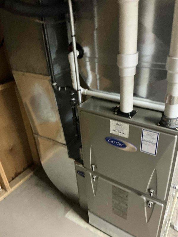 Provided comprehensive estimate for HVAC system replacement, presenting options for both full system replacement and AC-only replacement for existing Carrier furnace installation. Assessed current equipment condition and documented system configuration including condensate drainage and venting setup to determine appropriate replacement specifications.