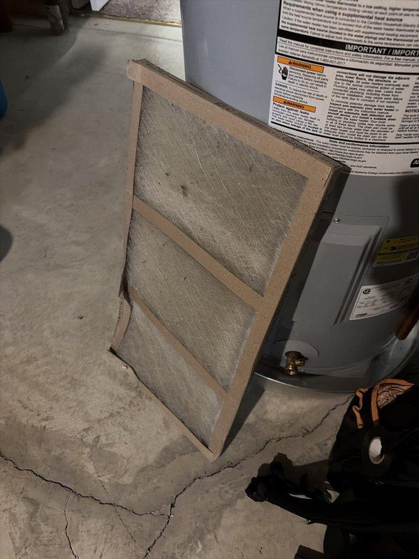 Completed seasonal cooling tune-up on residential HVAC system. Inspected furnace/air handler unit and associated mechanical equipment, checked refrigerant levels, electrical connections, and system operation. Replaced dirty air filter which showed significant dust accumulation and reduced airflow capacity.