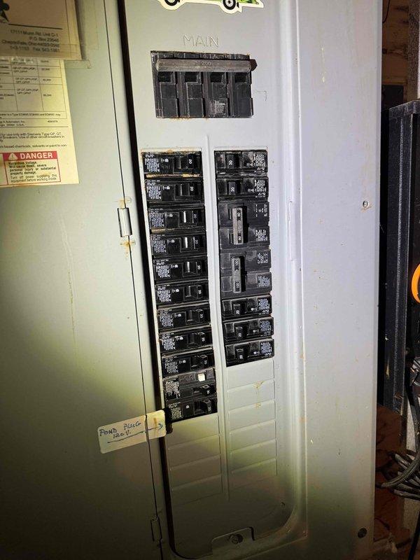 Responded to no cooling complaint on residential HVAC system. Upon arrival, inspected outdoor unit electrical compartment and found all wiring connections intact with capacitor and contactor properly mounted. Verified electrical panel breakers were in correct positions with no tripped circuits. System components showed normal wear for age with no immediate electrical failures detected in control circuit or power supply.