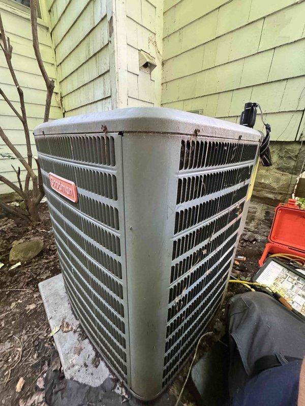 Responded to no cooling complaint on residential air conditioning system believed to be installed in early 2000s. Upon arrival, performed diagnostic testing on outdoor condenser unit using digital multimeter to measure electrical values at contactor and control components. Accessed electrical panel to inspect wiring connections, contactors, and internal components. Unit showed signs of age with weathered exterior casing and outdoor exposure. Completed electrical diagnostics and system evaluation to determine cause of cooling failure.