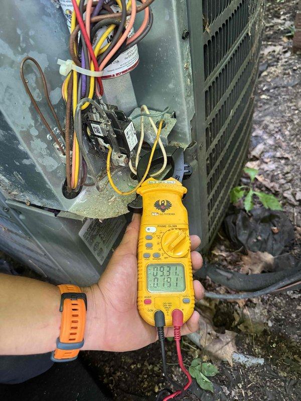 Responded to no cooling complaint on residential air conditioning system believed to be installed in early 2000s. Upon arrival, performed diagnostic testing on outdoor condenser unit using digital multimeter to measure electrical values at contactor and control components. Accessed electrical panel to inspect wiring connections, contactors, and internal components. Unit showed signs of age with weathered exterior casing and outdoor exposure. Completed electrical diagnostics and system evaluation to determine cause of cooling failure.