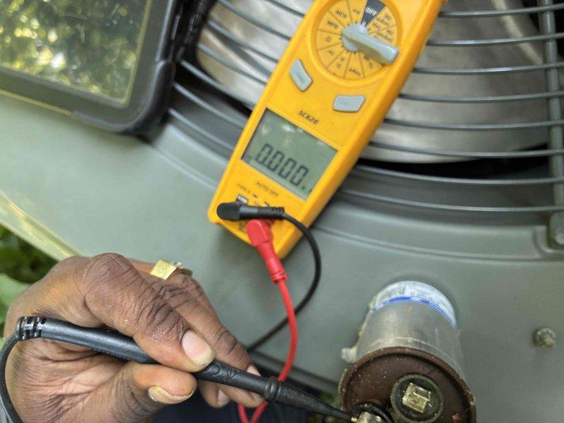 # HVAC Service Completed

Responded to no cooling call with system not turning on. Upon arrival, performed electrical diagnostics on outdoor condensing unit. Used digital multimeter to test capacitor voltage and continuity. Inspection revealed failed dual run capacitor with visible signs of deterioration including rust and corrosion on terminals. Capacitor tested outside acceptable microfarad range, preventing compressor and condenser fan motor from starting. Replaced defective capacitor with new unit matching proper specifications. Verified all electrical connections secure and tested system operation. Unit now cooling properly with compressor and fan motor running within normal parameters.