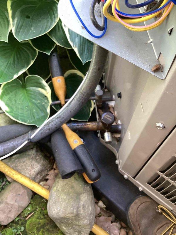 Responded to no cooling complaint and performed scheduled preventive maintenance on residential air conditioning system. Inspected indoor air handler unit including filter and ventilation components, then proceeded to outdoor condensing unit. Evaluated refrigerant line connections, copper piping insulation, and mechanical components of outdoor unit. All refrigerant lines properly insulated and secured, coils accessible for inspection, and unit operational following service visit.