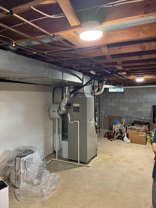 Completed comprehensive HVAC system evaluation for full replacement of aging equipment in basement installation. Assessed existing Trane system including furnace unit and thermostat, documented current configuration with metal ductwork and PVC venting, and presented multiple replacement options to address the older system's declining performance and efficiency.