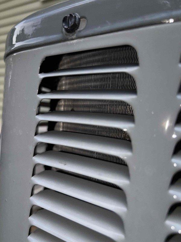 Performed comprehensive cooling system maintenance on HVAC unit. Inspected and photographed condenser coil assembly, confirming proper fin alignment and heat exchanger integrity. All components found in operational condition with minimal debris accumulation, ensuring optimal airflow and system efficiency for continued reliable cooling performance.