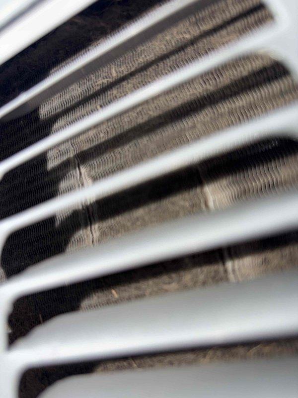 Performed comprehensive cooling system maintenance on HVAC unit. Inspected and photographed condenser coil assembly, confirming proper fin alignment and heat exchanger integrity. All components found in operational condition with minimal debris accumulation, ensuring optimal airflow and system efficiency for continued reliable cooling performance.