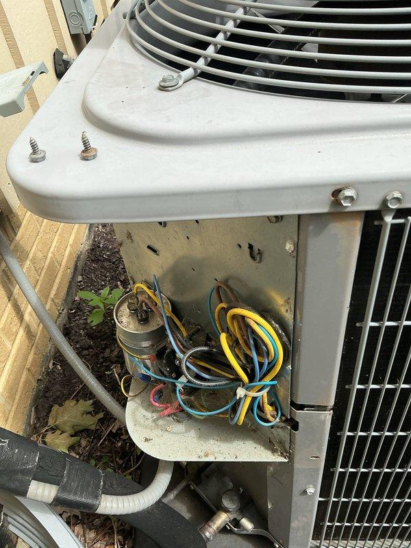 Responded to a no-cooling call on a 9-year-old air conditioning system. Upon arrival, found the outdoor condensing unit inoperative with visible signs of neglect including debris accumulation around the base and weathered exterior panels. Opened the electrical compartment and identified a failed capacitor as the primary cause of system failure. Replaced the defective capacitor with a new unit rated to manufacturer specifications. Cleared accumulated leaves, pine needles, and organic debris from around the unit base to restore proper airflow and prevent future operational issues. Verified proper electrical connections, tested voltage and amperage readings, and confirmed thermostat communication. Cycled the system through a complete startup sequence and verified cooling operation restored to normal parameters. Discussed the benefits of preventative maintenance program enrollment with the customer, explaining how regular tune-ups can prevent unexpected failures and extend equipment lifesp