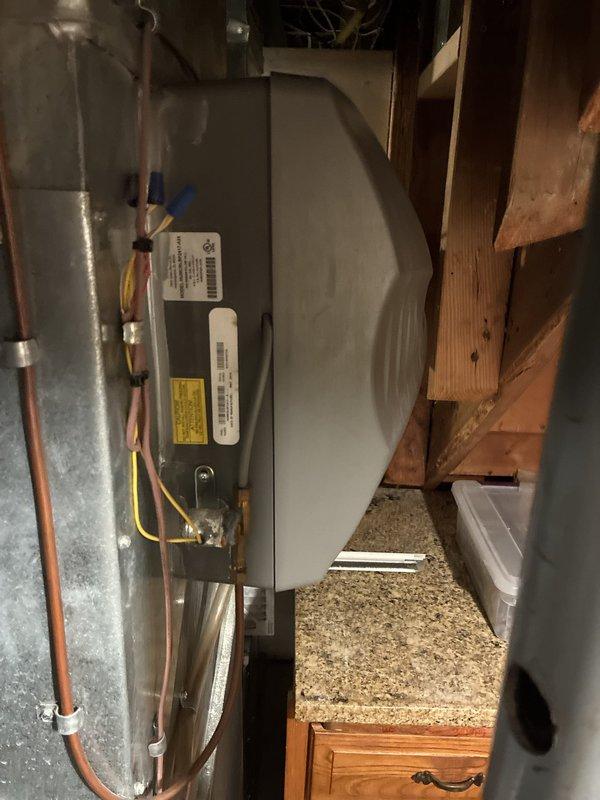 Conducted comprehensive HVAC system evaluation for equipment replacement estimate. Inspected existing air handler unit installed in attic space, documenting current system configuration including refrigerant line connections, electrical connections, and overall equipment condition. Assessed furnace or air handler unit in mechanical space, noting condensate drain assembly with PVC piping, existing plumbing connections, and installation platform. Photographed equipment specifications, manufacturer labels, and surrounding installation environment to provide accurate replacement options. Customer is reviewing multiple quotes for system replacement.
