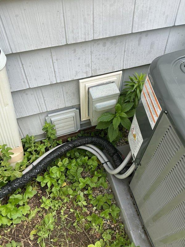 Responded to service call regarding damaged insulation on exterior refrigerant line set. Upon arrival, inspected the outdoor condensing unit and associated copper refrigerant piping. Found the black foam insulation on the suction line had been severely cut and compromised, exposing the copper tubing to ambient conditions. Replaced the damaged insulation section with new foam pipe insulation, ensuring proper coverage and sealing to prevent condensation and maintain system efficiency. Verified all refrigerant lines were properly protected and secured.