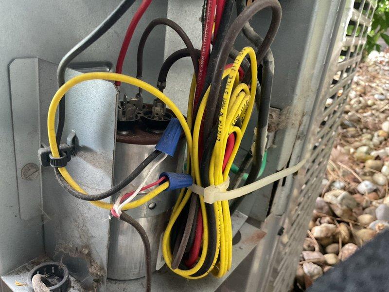 Completed cooling system tune-up including electrical diagnostics and temperature verification. Tested capacitor operation and voltage readings at outdoor unit control panel, confirming proper electrical function. Measured supply air temperature at plenum registering 52.9°F, indicating adequate cooling performance. Customer reported concerns regarding inadequate airflow to rear bedroom, likely related to damper positioning or adjustment in ductwork system requiring further evaluation.