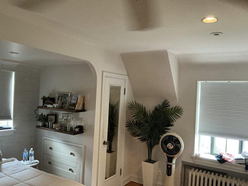 Evaluated upstairs area for mini split installation options. Assessed two rooms including bathroom with existing radiator heating and bedroom with traditional radiator system and ceiling-mounted lighting. Documented current heating infrastructure and spatial layout to determine optimal placement for indoor air handling units. Provided customer with recommendations for ductless mini split configuration to supplement existing heating system in second-floor living spaces.