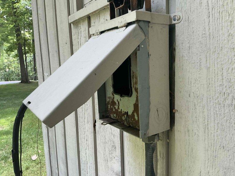 Conducted full system assessment on non-functional Lennox HVAC system with no cooling capability. Presented three complete replacement options featuring Goodman air conditioning and gas furnace combinations: Good tier system with up to 13.4 SEER and 80% AFUE efficiency ratings, Better tier system with up to 14 SEER and 96% AFUE ratings, and Best tier system with up to 16 SEER and 96% AFUE ratings. Documented existing outdoor electrical disconnect box showing weathering and age-related deterioration, as well as current basement ductwork configuration and equipment layout for replacement planning purposes.