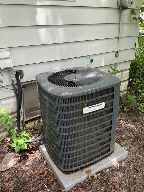 Responded to no cooling complaint on residential split system air conditioning unit. Upon arrival, performed diagnostic evaluation of outdoor condensing unit and indoor air handler components. Utilized digital multimeter to test electrical parameters and verify system operation. Inspected refrigerant lines, ductwork insulation, and overall equipment condition in attic installation. Unit showed signs of age with weathered exterior cabinet and oxidation on copper refrigerant lines. Identified and resolved issue preventing cooling operation. System restored to normal function with proper airflow and temperature output confirmed.