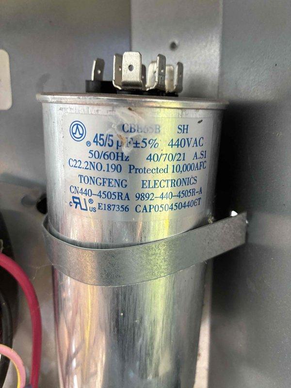# HVAC Cooling Maintenance Summary

Completed comprehensive preventive maintenance service on residential air conditioning system. Performed electrical diagnostics using digital multimeter, verifying system amperage draw at 23.0 amps within normal operating parameters. Inspected and tested dual-run capacitor (45/5 MFD, 440VAC) manufactured by Tongfeng Electronics, confirming proper electrical ratings and secure mounting. All electrical connections, terminals, and wiring found in satisfactory condition with no signs of degradation or overheating. System operating efficiently with all components functioning within manufacturer specifications.