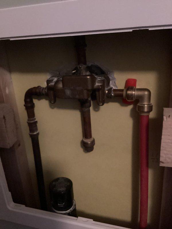 Responded to service call for historic farmhouse bathroom shower system. Successfully replaced failed Moen balancing valve in existing shower installation. Accessed plumbing assembly through wall panel, removed corroded valve assembly, and installed new pressure-balancing valve to restore proper temperature control and water flow to the shower fixture.