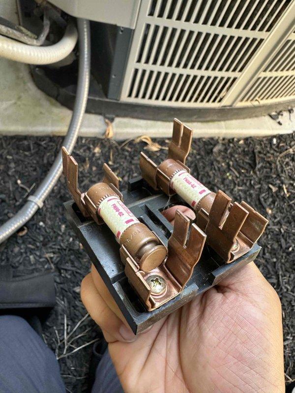 Completed comprehensive cooling system maintenance inspection on residential HVAC unit. Performed detailed examination of electrical control panel components, verifying all wire connections at terminal blocks were secure and properly torqued. Inspected and tested dual fuse assembly in disconnect housing, confirming proper amperage rating and electrical continuity. All electrical connections, capacitor, and safety devices found to be functioning within normal operating parameters, with system ready for continued cooling season operation.