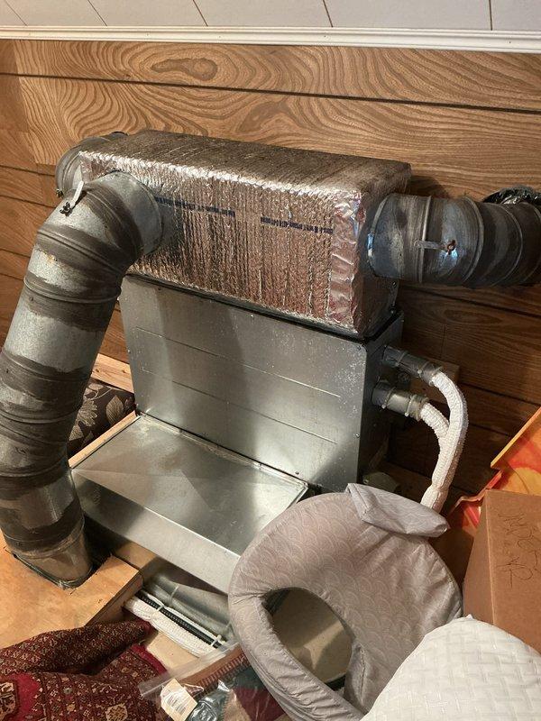 Responded to no cooling call where system would not turn on. Upon arrival, inspected Halcyon inverter air handler unit located in attic space. Found significant condensation accumulation on supply ductwork and verified unit operational status. Documented equipment condition with photos showing moisture on insulated ductwork and air handler installation.
