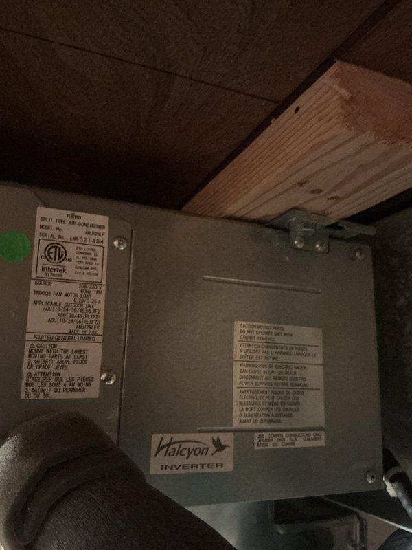 Responded to no cooling call where system would not turn on. Upon arrival, inspected Halcyon inverter air handler unit located in attic space. Found significant condensation accumulation on supply ductwork and verified unit operational status. Documented equipment condition with photos showing moisture on insulated ductwork and air handler installation.