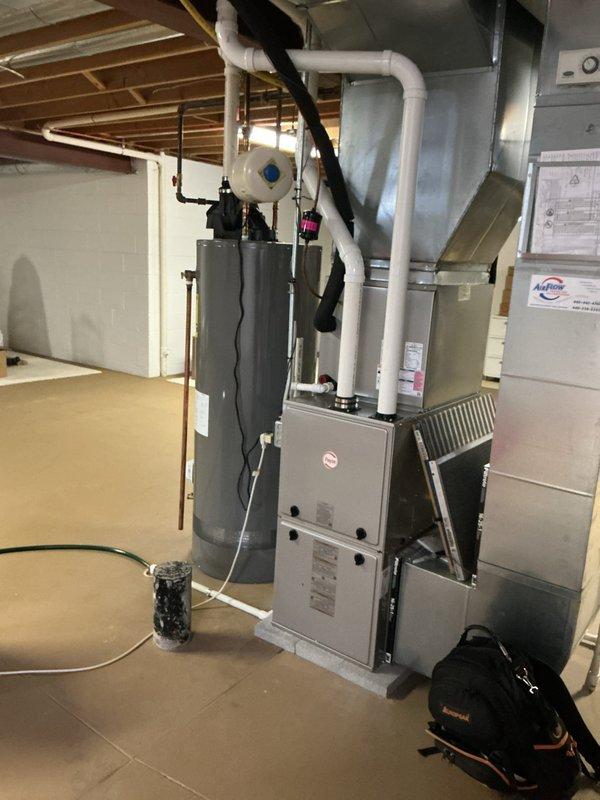 Completed routine cooling system maintenance on residential HVAC unit located in basement mechanical room. Performed comprehensive inspection of air conditioning components, verified electrical connections, and tested system operation using diagnostic equipment. All equipment operating within normal parameters; documented conditions with photographic evidence for service records.