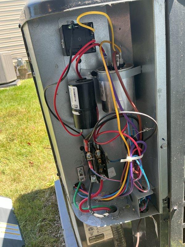 Completed system tune-up service at customer's request. Inspected outdoor unit electrical components including capacitor and contactor, verifying all connections and wiring integrity. Checked system temperatures with infrared thermometer, recording 68.1°F at ductwork. Customer requested to view Aprilaire filter label for future self-ordering reference; provided access to filter specifications and brand information as requested.