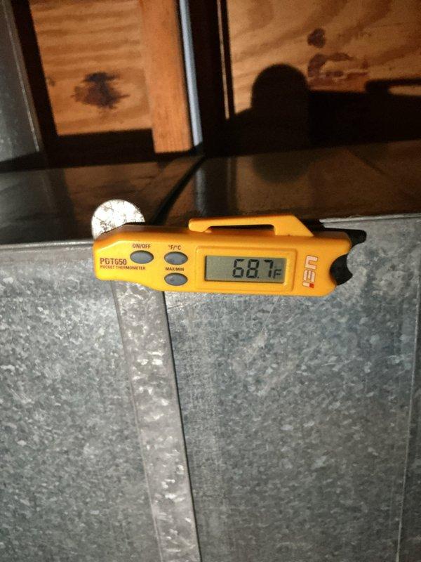 Completed system tune-up service at customer's request. Inspected outdoor unit electrical components including capacitor and contactor, verifying all connections and wiring integrity. Checked system temperatures with infrared thermometer, recording 68.1°F at ductwork. Customer requested to view Aprilaire filter label for future self-ordering reference; provided access to filter specifications and brand information as requested.