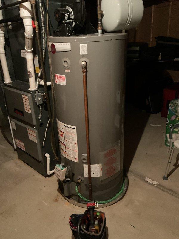 Performed comprehensive tune-up service on residential tanked water heater, including inspection of all safety labels, temperature and pressure relief valve, gas connections, and copper supply lines. Verified proper operation of heating elements, checked expansion tank mounting, inspected drain valve and base connections, and confirmed all components were functioning within manufacturer specifications.
