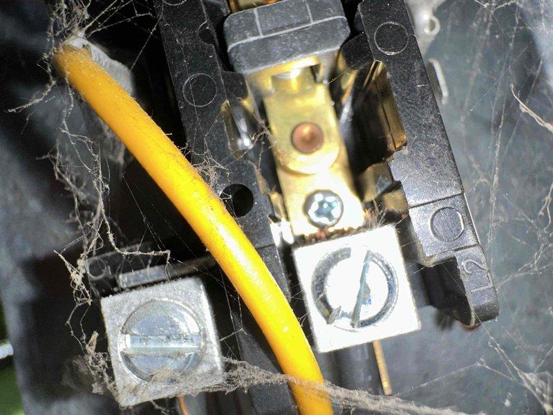 # HVAC Maintenance - Cooling System Service

Completed scheduled preventive maintenance on residential air conditioning system. Performed comprehensive inspection of electrical components, including terminal connections and capacitor assembly. Observed significant accumulation of dust, lint, and debris on electrical terminals and wiring connections, which was documented. Utilized clamp meter to verify electrical readings and system performance parameters. All electrical connections were inspected for proper termination and secure mounting. System operational at time of service completion.