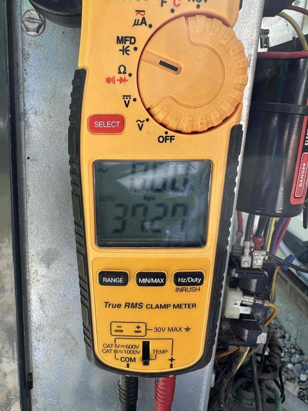 # HVAC Maintenance - Cooling System Service

Completed scheduled preventive maintenance on residential air conditioning system. Performed comprehensive inspection of electrical components, including terminal connections and capacitor assembly. Observed significant accumulation of dust, lint, and debris on electrical terminals and wiring connections, which was documented. Utilized clamp meter to verify electrical readings and system performance parameters. All electrical connections were inspected for proper termination and secure mounting. System operational at time of service completion.
