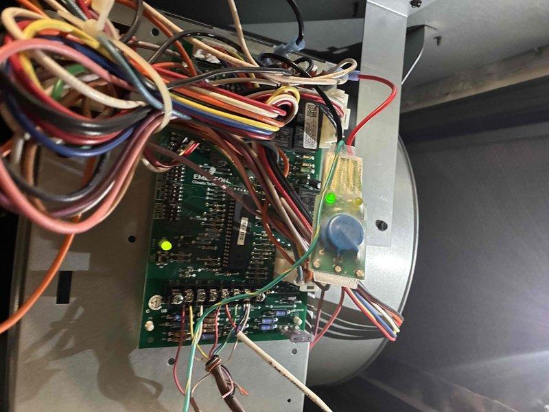Replaced failed dual-run capacitor with new TOTALINE P291-7054R unit rated at 70/5μF, 440VAC. Installed surge protection devices on both indoor air handler and outdoor condensing unit to protect control boards and compressor from voltage spikes and power surges.