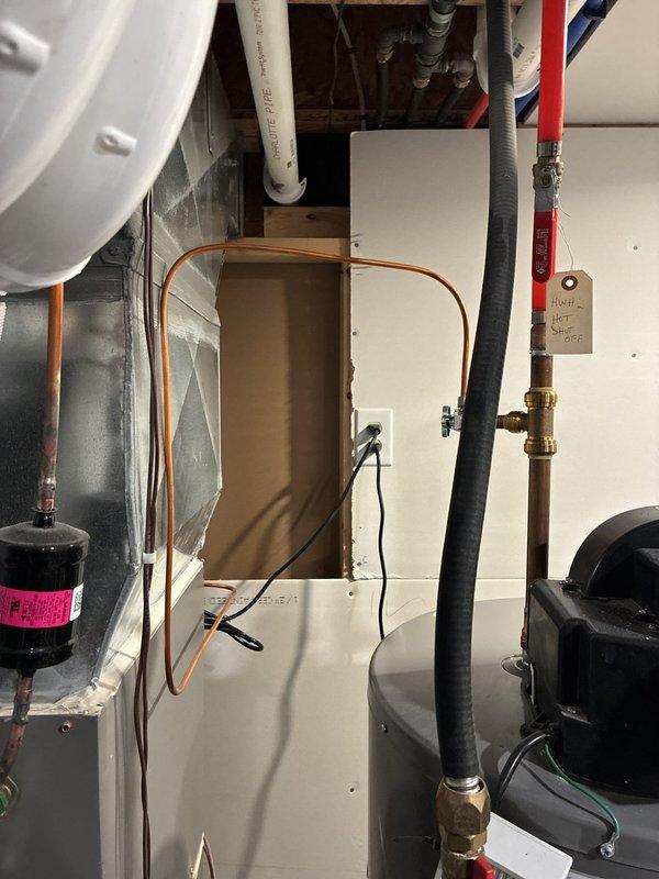 Conducted comprehensive assessment of existing Lennox furnace system to evaluate heating capacity concerns. Documented current equipment configuration including furnace unit, associated PVC venting, copper refrigerant lines, and system components to develop full replacement options addressing potential undersizing issues for the residence.