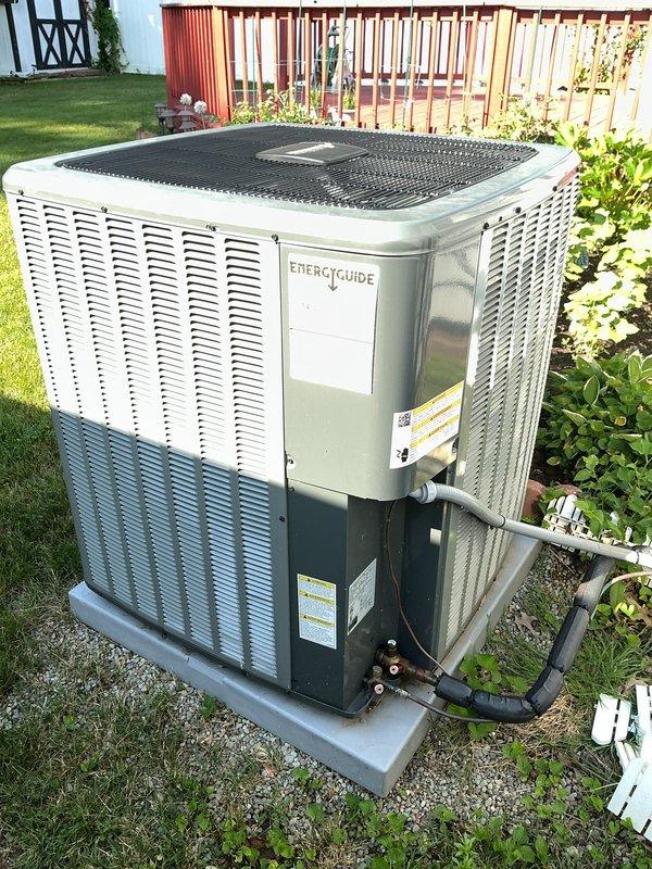 Completed scheduled preventative maintenance on residential air conditioning system. Performed comprehensive inspection of outdoor condenser unit, including examination of refrigerant lines, electrical connections, and conduit integrity. Verified proper operation of fan assembly, checked condenser coil condition through protective grille, and confirmed unit was securely mounted on concrete pad with adequate clearance from surrounding structures. All components found to be functioning within normal parameters with no immediate service requirements identified.