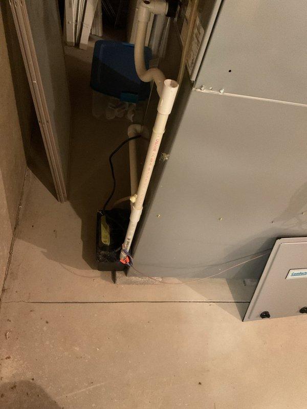 Completed scheduled preventive maintenance on residential cooling system. Inspected HVAC equipment, ductwork, and associated mechanical components in basement utility area. Verified proper operation of condensate pump assembly and drainage system, checked water treatment filter on copper supply lines, and documented equipment conditions with photographic records for service history.